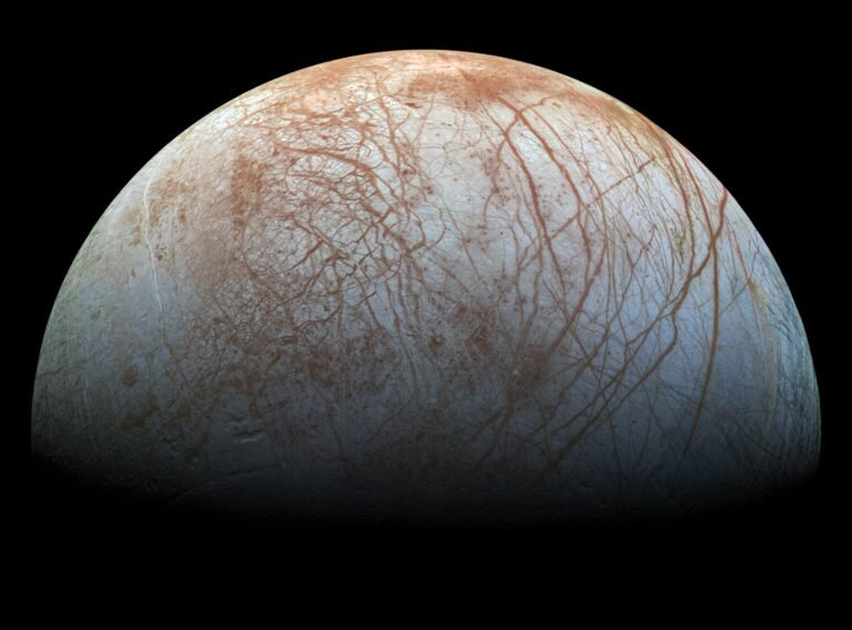 True color view of Jupiter's icy moon Europa showing cracked and ridged ice surface, assembled from NASA Galileo spacecraft images
