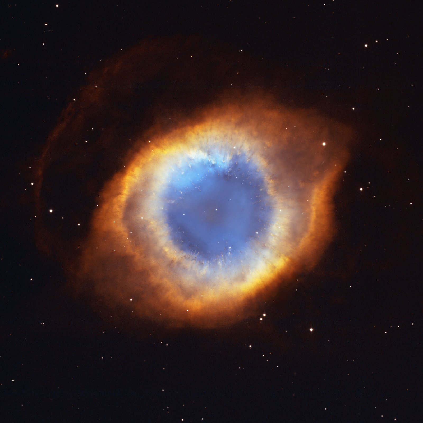 Hubble Space Telescope composite image of the Helix Nebula, a glowing ring of gas and dust surrounding a central white dwarf star