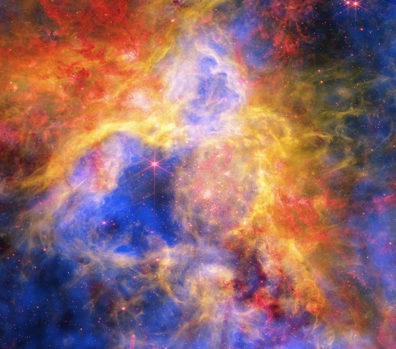 Multiwavelength composite image of the Tarantula Nebula combining X-ray data from Chandra, infrared data from Webb, and optical data from Hubble