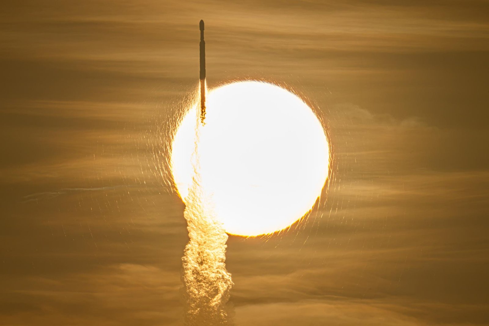 A SpaceX Falcon Heavy rocket carrying NASA's Nancy Grace Roman Space Telescope transits the sun during launch from Launch Complex 39A