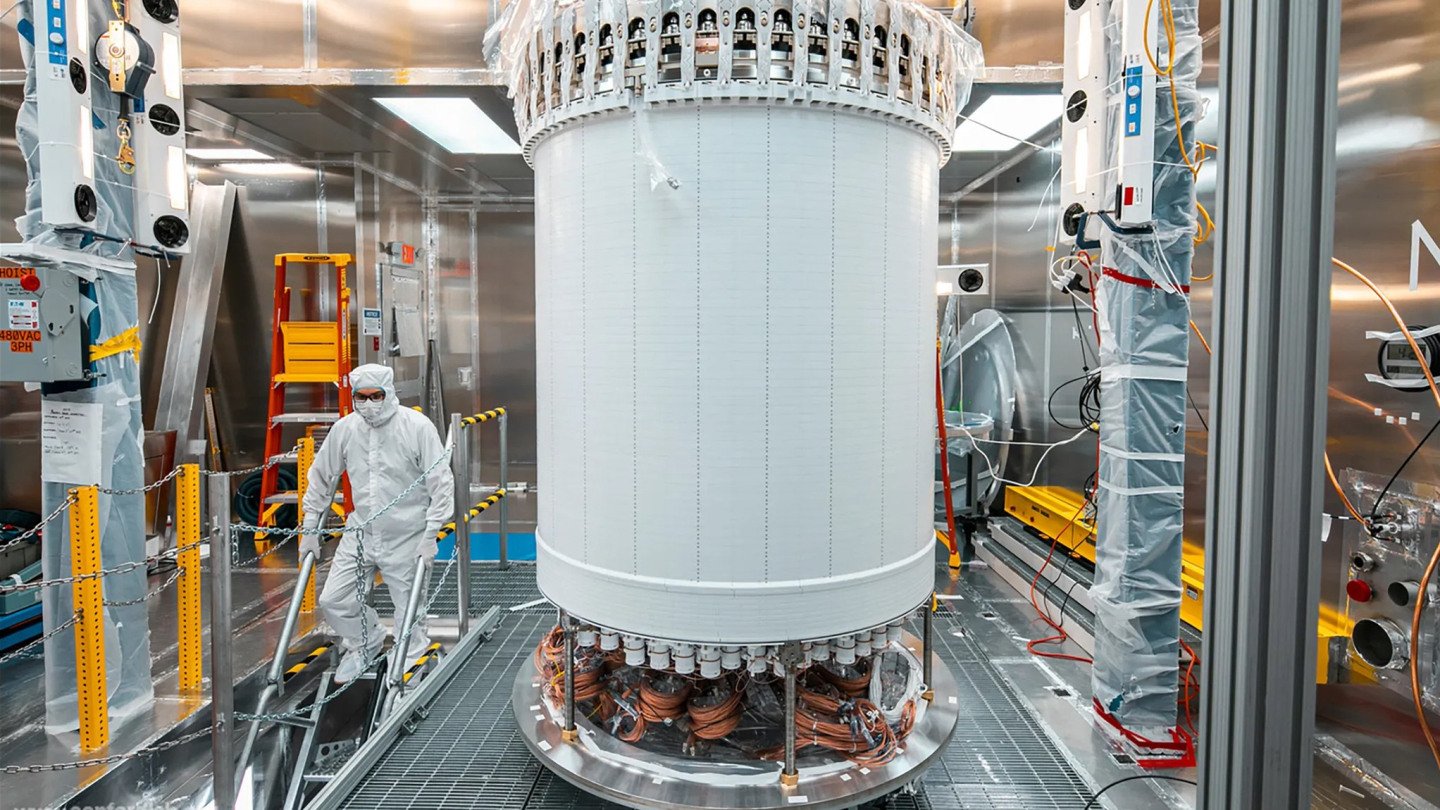 The LUX-ZEPLIN main dark matter detector, a large cylindrical tank, pictured in a surface lab before its installation nearly a mile underground at the Sanford Underground Research Facility